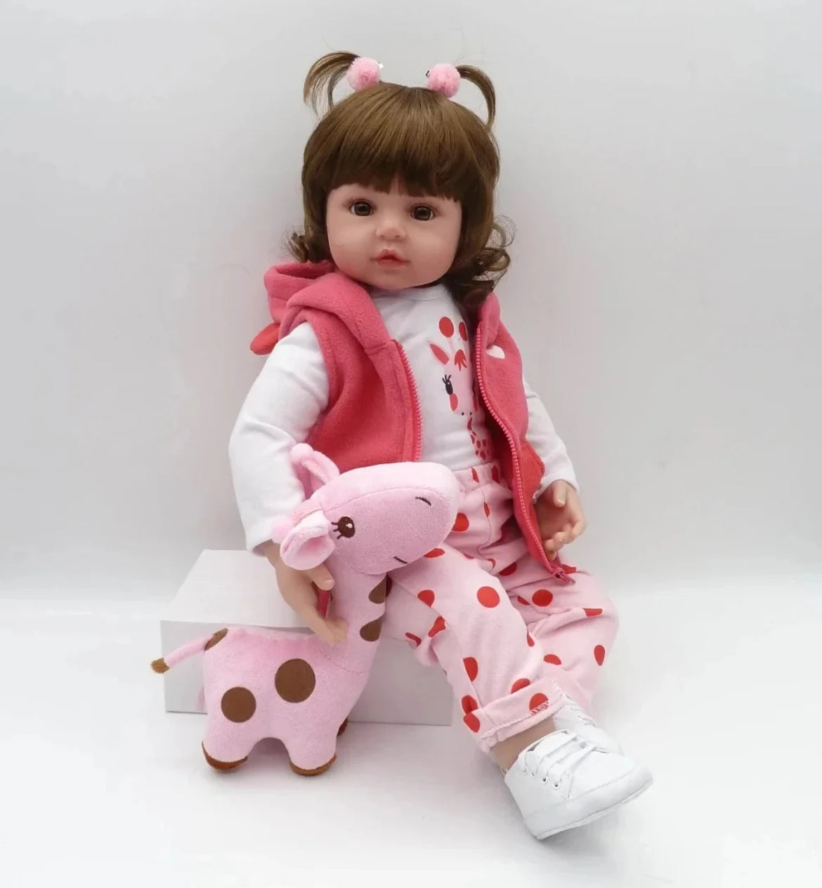 Josie 19 inch reborn baby doll with her giraffe